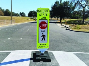 In-Street Pedestrian Crosswalk Sign near Schools - Transportation Solutions and Lighting, Inc