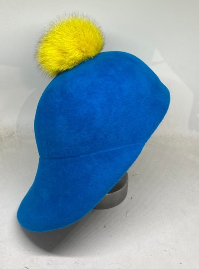 Womens fur felt blue and yellow pom pom cap.
