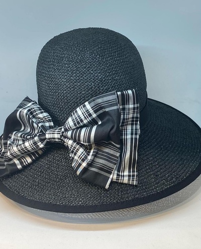 Stunning summer black straw hat with silk bow and band.