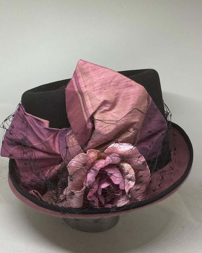 Womens black and purple mad hatter.