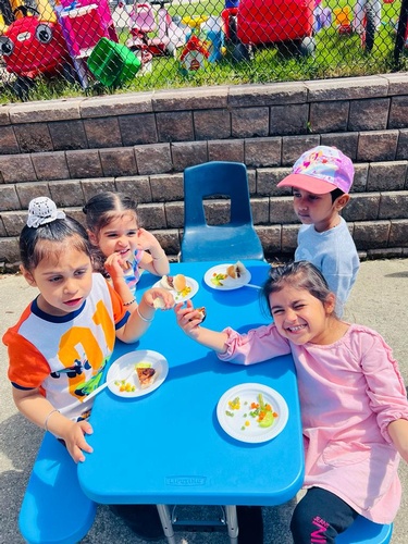 Preschool children eating together at HIDE ‘n' SEEK DAYCARE - Licensed Childcare Center in Brampton, Ontario