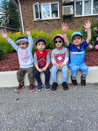 Preschool children sitting together at HIDE ‘n' SEEK DAYCARE - Day Care Center in Brampton, Ontario