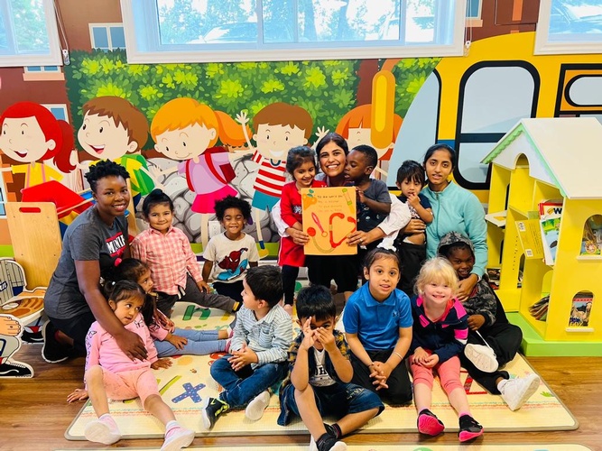 Group picture of the doctor with all the preschool children at HIDE ‘n' SEEK DAYCARE - Preschool in Brampton