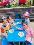 Preschool children eating together at HIDE ‘n' SEEK DAYCARE - Licensed Childcare Center in Brampton, Ontario