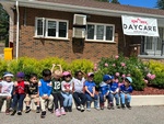 Preschool children posing together outside HIDE ‘n' SEEK DAYCARE - Licensed Childcare Center in Brampton, ON