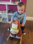 Child riding a soft toy horse at HIDE ‘n' SEEK DAYCARE - Day Care Center in Brampton, Ontario