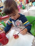 Child painting with colors at HIDE ‘n' SEEK DAYCARE - Licensed Childcare and Preschool in Brampton, Ontario