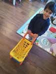 Happy Shopper child playing with a basket at HIDE ‘n' SEEK DAYCARE - Day Care Center in Brampton, Ontario
