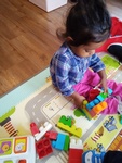 Baby playing with blocks at HIDE ‘n' SEEK DAYCARE - Licensed Childcare Center in Brampton, Ontario