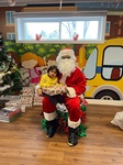 Santa giving Riana gifts for christmas at HIDE ‘n' SEEK DAYCARE - Licensed Childcare Center in Brampton, ON
