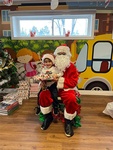 Santa giving Will gifts for christmas at HIDE ‘n' SEEK DAYCARE - Day Care Center in Brampton, ON