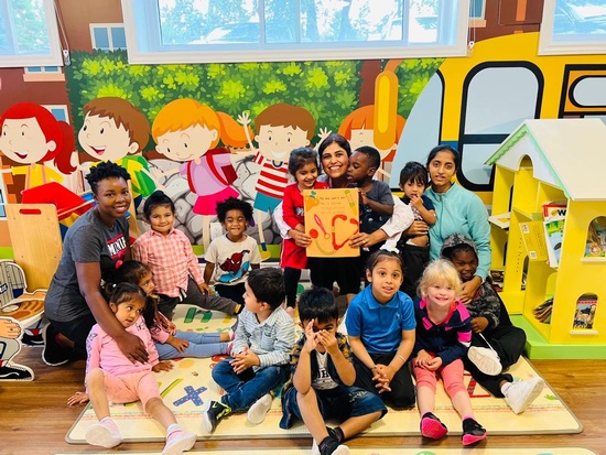 Group picture of the doctor with all the preschool children at HIDE ‘n' SEEK DAYCARE - Preschool in Brampton