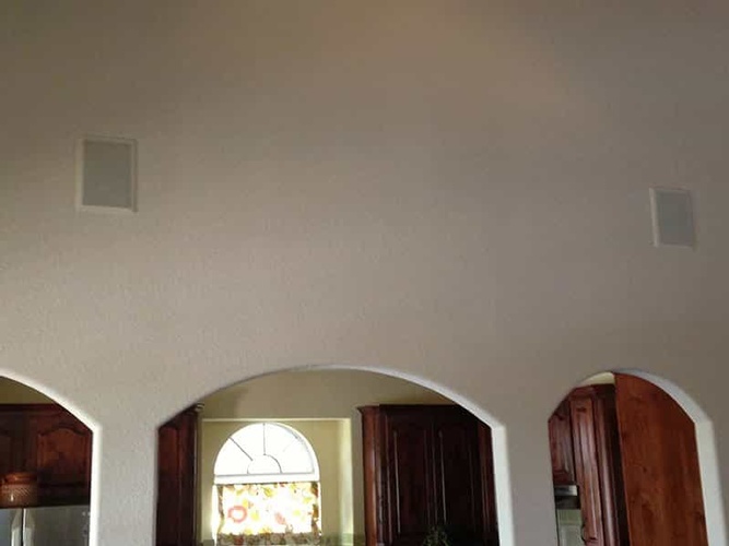 Speaker installed in the walls with Multi-room sound installation services by BTZ Audio Video, LLC.
