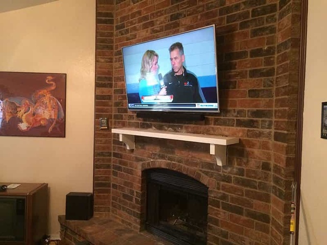 Installation of TV on the wall by a professional of BTZ Audio Video, LLC.