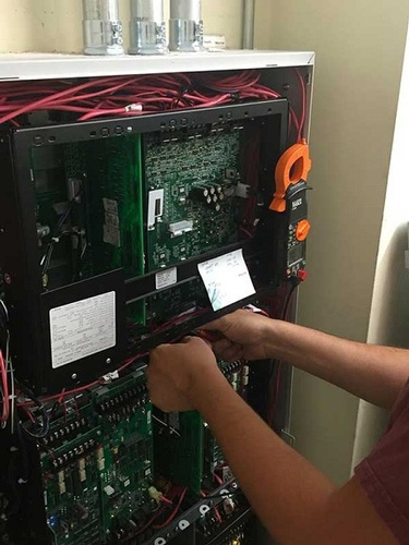 The Crew at Eastern Electrical Systems carrying out the installation of the modern fire alarm system panel