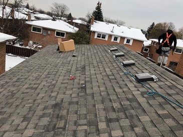 Residential Roofing done with plastic rubberized roof shingles by Imperial Roofs and Aluminum