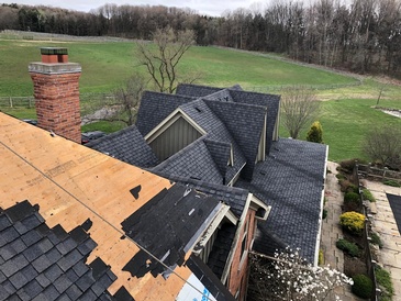 Installation of Rubber Roofing Shingles for home by Imperial Roofs and Aluminum