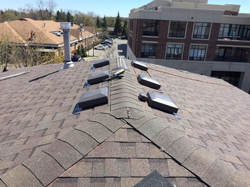 Rubberized roofing shingles used for residential property by expert roofers of Roofing Company Toronto