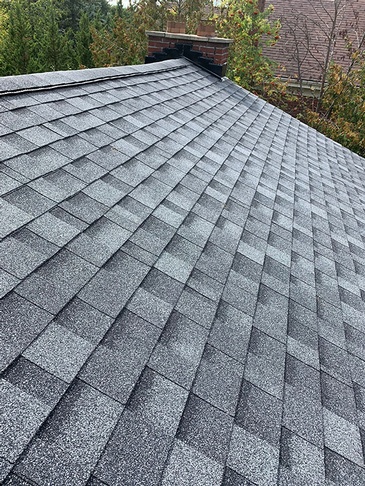 House installed with slate roofing by expert roofers of Imperial Roofs and Aluminum