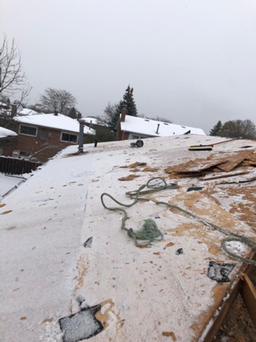 Roof Repairing carried out in snowy areas by professional roofers of Imperial Roofs and Aluminum
