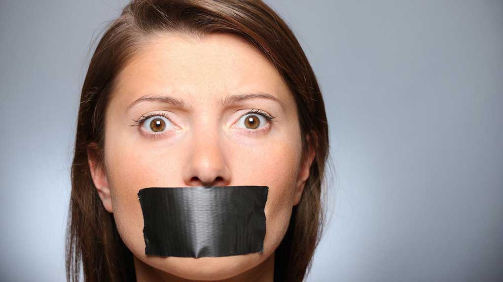 A lady has tape over her mouth, signifying no video sound.