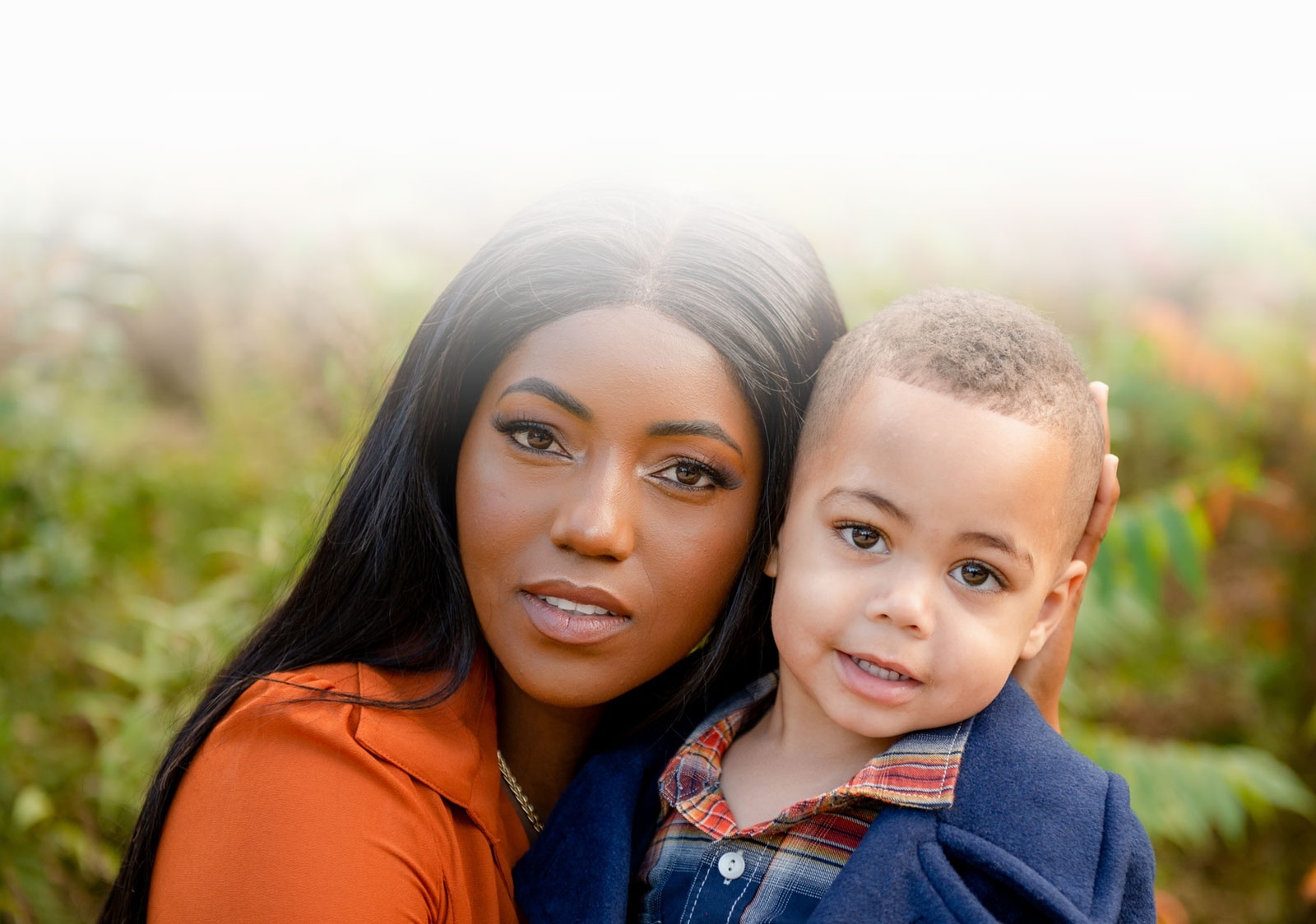 High Quality Headshot Photography of a young boy with mother captured by Flores Photography in Toronto