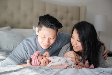 Portrait Photography of a couple with their newborn captured by Flores Photography in Toronto