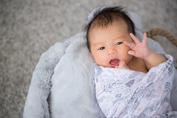 Professional Portrait Photography of a newborn baby by Flores Photography in Toronto