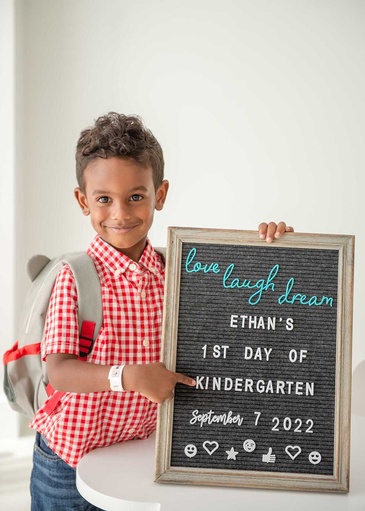 Portrait of a boy on his first day at kindergarden captured by Flores Photography