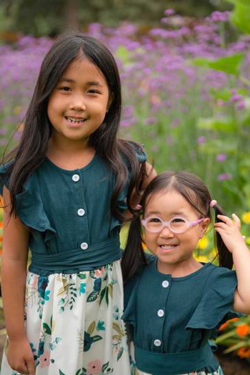 Professional Photography of a cute sisters captured by Flores Photography in toronto