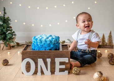 Portrait photography of an infant celebrating his first captured by Flores Photography in toronto