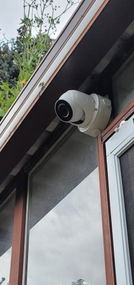 Security camera mounted on house side, installed by Integral Konnect in Richmond Hill.
