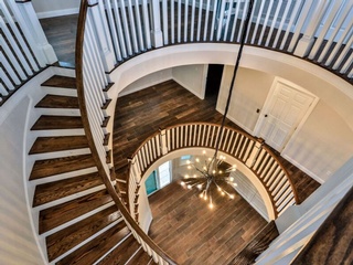 Modern Round Staircase build for Custom Home by Home Builders of Newberry