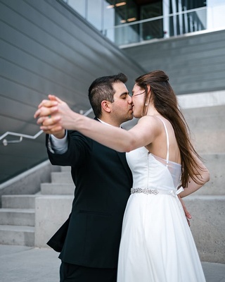 Beautiful picture of wedding couple kissing captured by Darkstrand Visuals