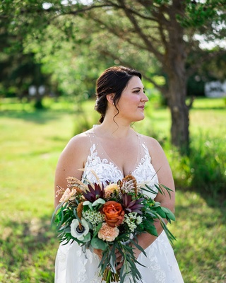 Beautiful Wedding bride holding flower bouquet photo captured by Darkstrand Visuals