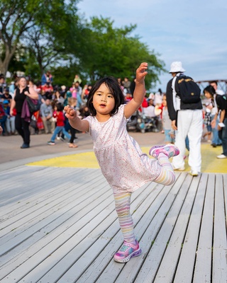 A cute little girl dancing photo captured by Darkstrand Visuals