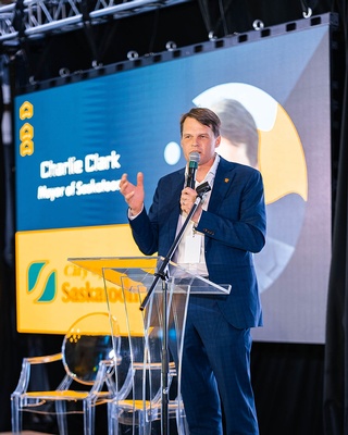Photo of Charlie Clark addressing the audience during the event captured by Darkstrand Visuals