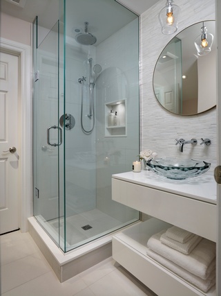A Luxurious glass partition door installed with bathroom renovation by Concept Build Group