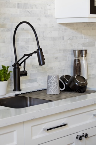 Concept Build Group's kitchen remodeling includes a lavish wash basin and a single-handle pull-down kitchen tap