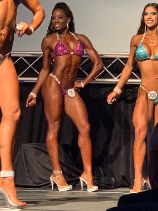 Clients of IzzyMo Fitness and Nutrition showcasing their best physique at a competition