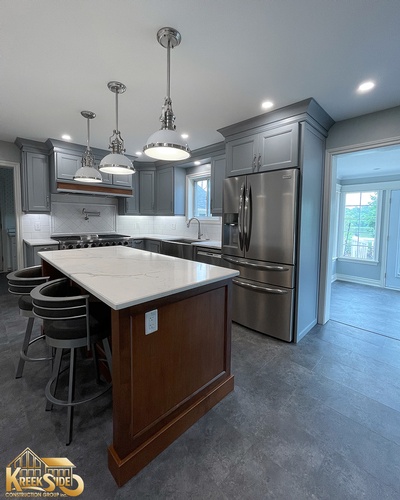 Kitchen Renovation Services with a chandelier setting done by Kreekside Construction Group Inc.