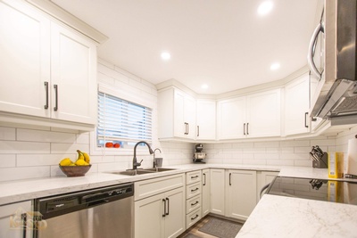 Kitchen Renovation Services with Bright White Cabinets done by Kreekside Construction Group Inc.