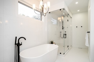 Newly renovated bathroom with a stunning lighting upgrade by Winnipeg's residential electrician