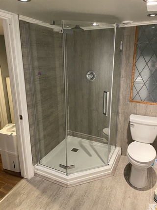 The shower Wall Partition was installed with bathroom renovation done by Parkhurst General Contracting