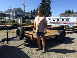 Happy Owner of Convenient Utility Flat Deck Trailers from Pacific Rim Trailer Sales