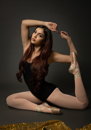Rawfa Productions LLC's portrait photography showcases the ethereal beauty and skill of a ballet dancer in a graceful pose