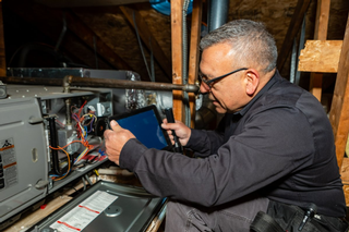 Summit Property Inspectors conducting professional HVAC systems inspection