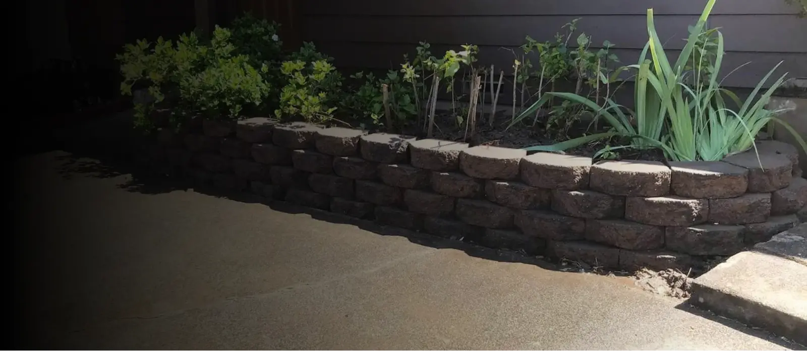 Enhance Your Landscape with Sturdy Concrete and Wood Retaining Wall Blocks for Added Strength