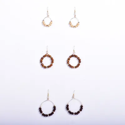 Enhance your accessory collection with a set of three exquisite Wood Bead Earrings, available Online