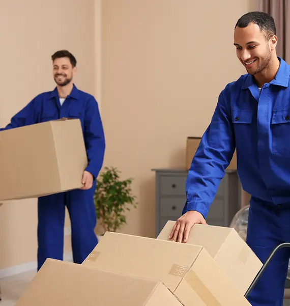 Professional movers coordinating a pick-up and storage service
